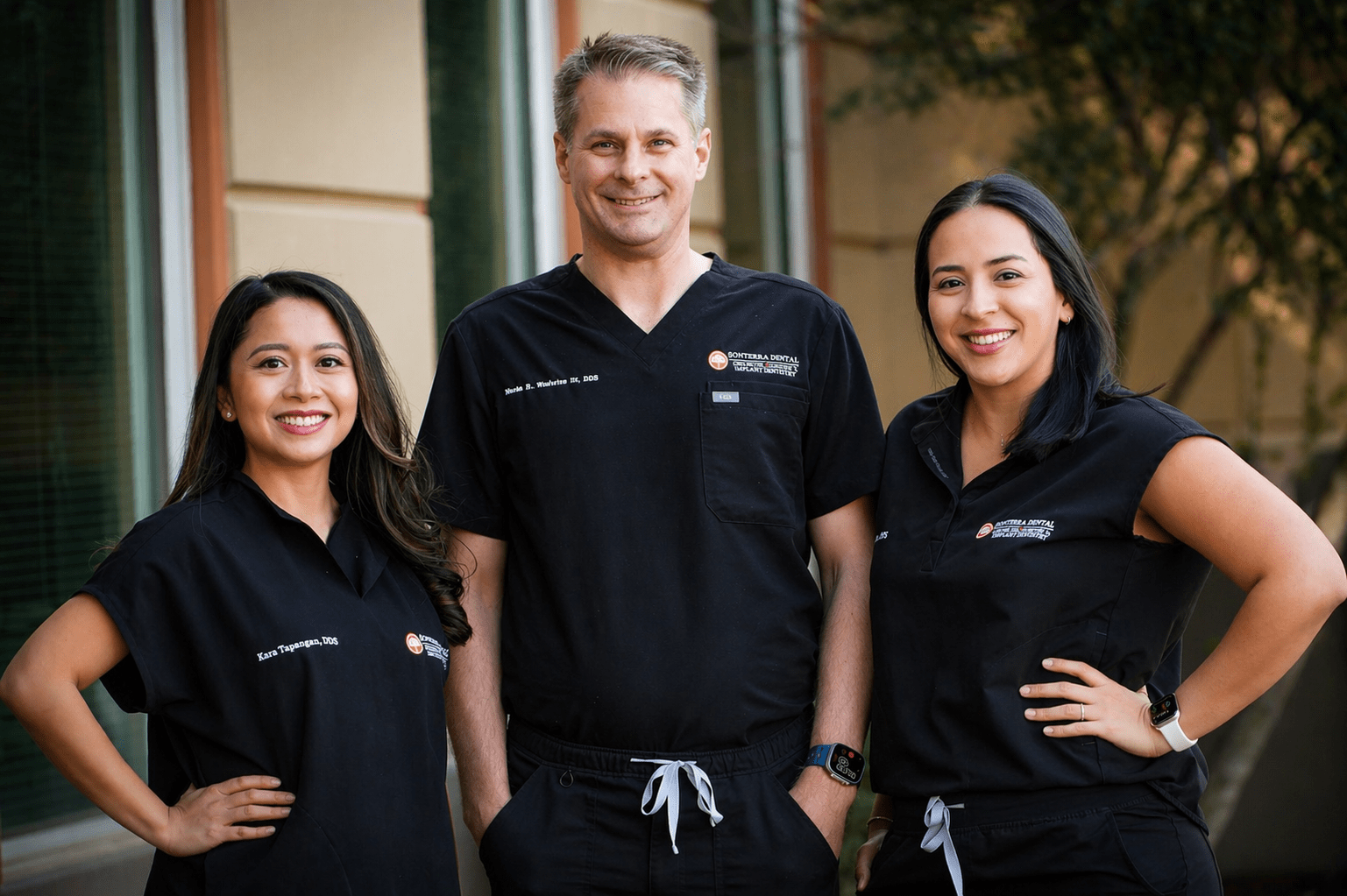 The doctors of Sonterra Dental — Dr. Woods Woolwine, Dr. Kara Tapangan, and Dr. Alexis Ruiz — at the Stone Oak office